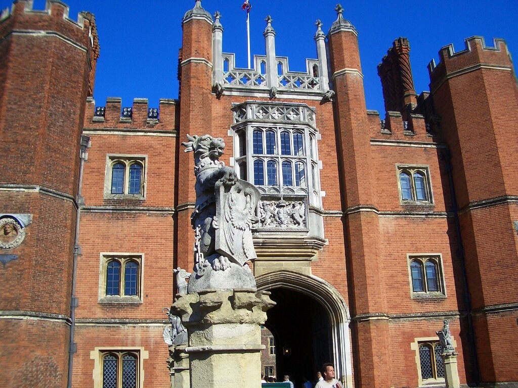 View of the medieval red brick facade of Hampton Court Palace