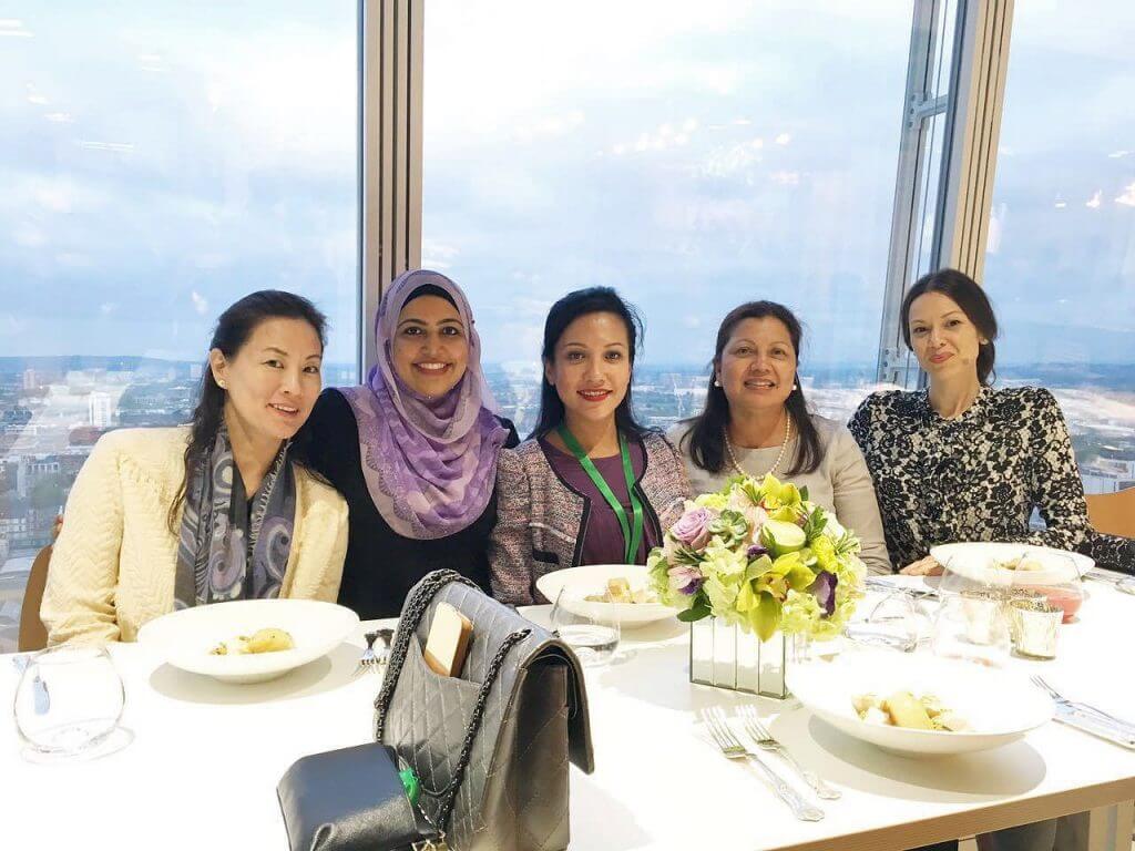 Group of 5 women enjoying lunch in a restaurant with views