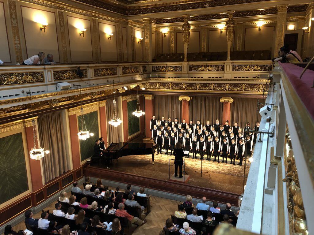 Children's choir performing in a theatre