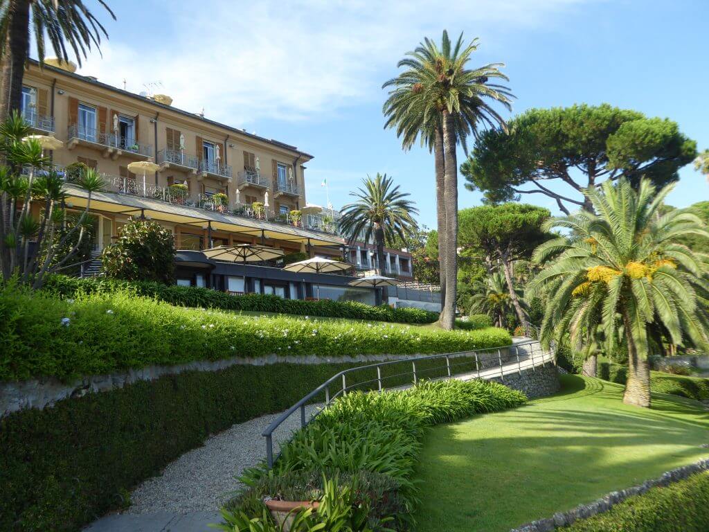 Beautiful hotel on a hill with palm trees in the gardn