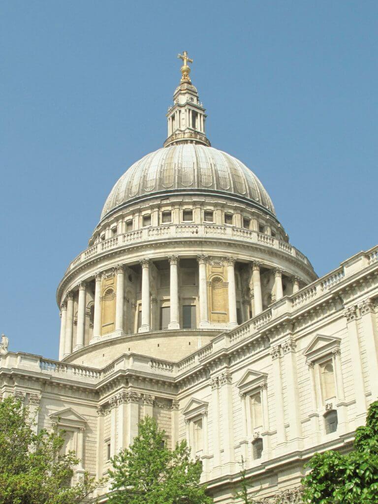 View of the dome of St Paul's Cathedral against a blue sky