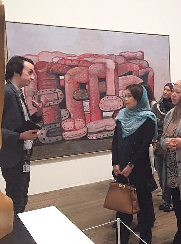 A group of ladies enjoying a guided tour of Tate Modern art gallery in London