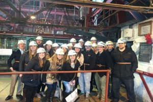 Group of students in hard hats at the National Mining Museum