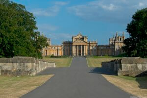 Blenheim Palace, viewed from the bridge. The facade of the building, with elegant portico, built in the 18th century English baroque style.