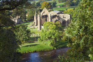 The Priory Ruins on the banks of the River Wharfe at Bolton Abbey, Wharfedale, in the Yorkshire Dales National Park.