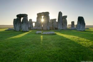 Stonehenge is a large henge or stone circle in Wiltshire, and an internationally recognised travel destination. Huge standing stones were dragged to the site and placed in the landscape in the era 2,500 BC. It is a UNESCO world heritage site.